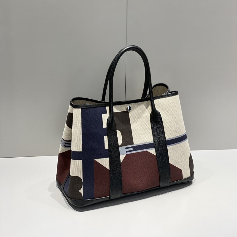 H**mes shopping bags